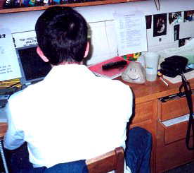 Jed and Stewart working at a desk.